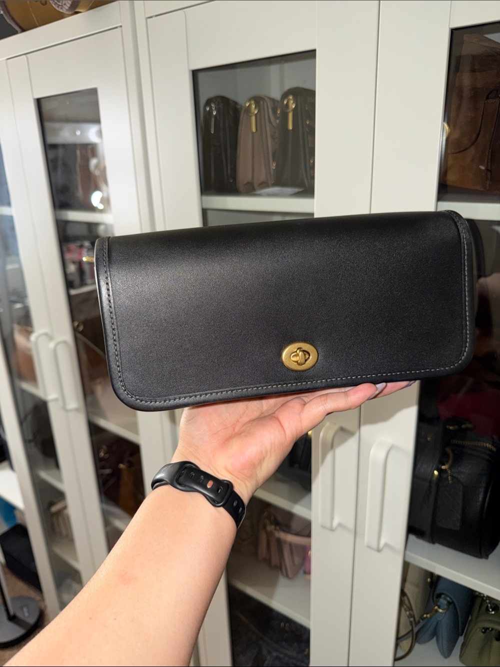 The dinky. Classic Black Leather Turnlock Clutch